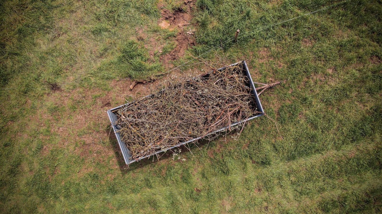 gray metal frame on green grass